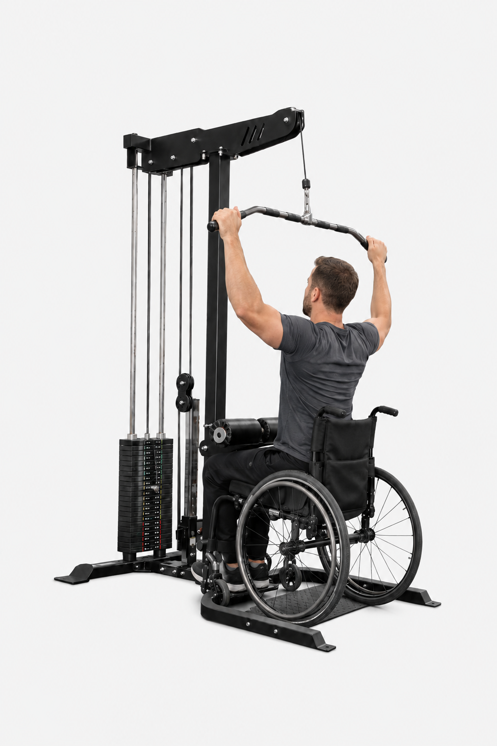 A man in a wheelchair uses a black cable pulley gym machine with a high pull-up bar, shown from behind against a light gray background.