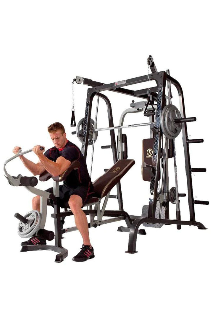 Blonde male doing preacher curls on gym bench