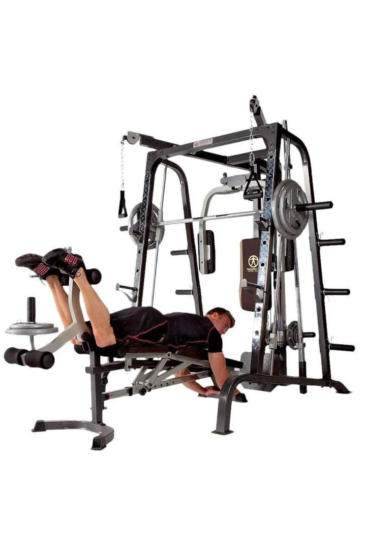 Blonde man doing hamstring curls on weight bench