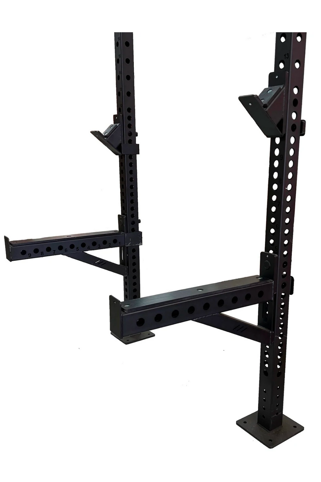 Safety spotter arms and barbell hooks attached to power rack