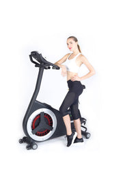 female leaning against exercise bike