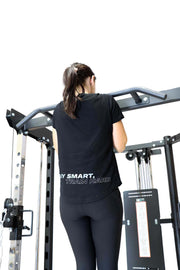 Female doing pull up on functional trainer