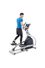 man working out on cross trainer